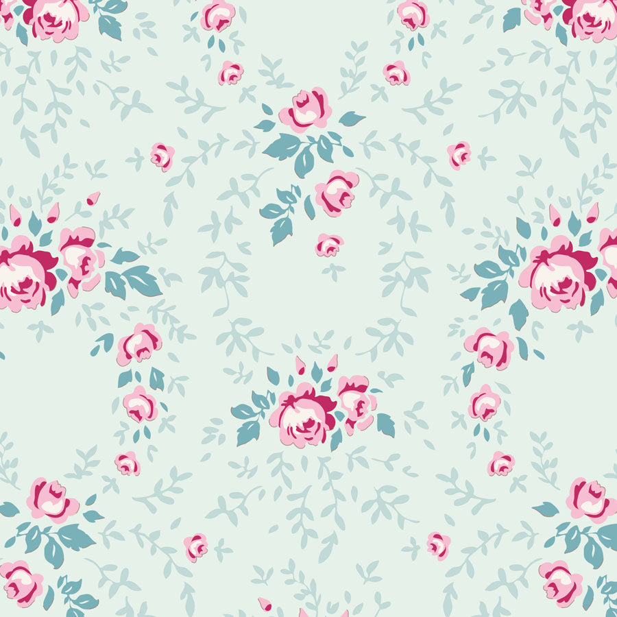 A repeating floral pattern featuring pink roses and light blue leaves on a pale mint green background.
Photo by Tildafabrics.com [image_link]