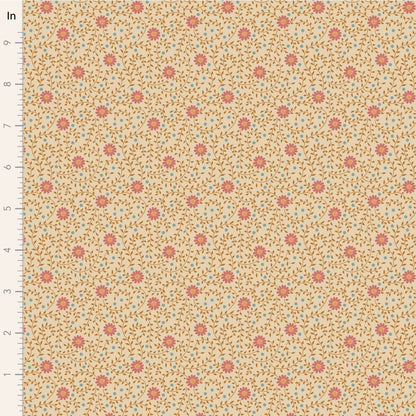 A close-up of a fabric pattern with a warm beige background, small coral-pink floral motifs, and fine brown and light blue leafy details. A vertical ruler marked in inches appears along the left edge.
Photo by Tildafabrics.com [image_link]