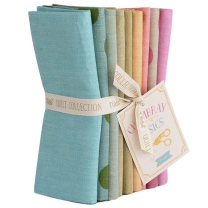 A bundle of folded woven fabrics in various spring pastel colors, tied together with a label that reads 'Tilda Quilt Collection'.
Photo by Tildafabrics.com [image_link]
