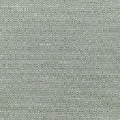 A close-up of a textured fabric swatch in a muted sage green color with a fine woven pattern.
Photo by Tildafabrics.com [additional_image_link]