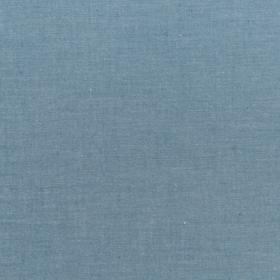 A close-up of a textured blue-gray woven fabric, showing a fine linen-like weave pattern.
Photo by Tildafabrics.com [additional_image_link]