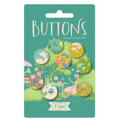 Packaging of Tilda Sunday Brunch fabric-covered buttons showing various designs and colors of the buttons, with a garden and friends enjoying a brunch setting illustrated at the background.
Photo by Tildafabrics.com [image_link]