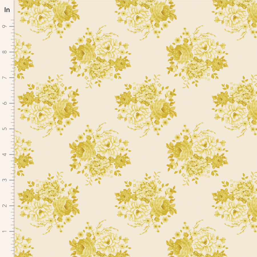 A fabric from the Tilda Sunday Brunch Mia Sour Yellow collection, featuring a floral pattern with yellow flowers on a beige background, measured with a ruler to show scale.
Photo by Tildafabrics.com [image_link]