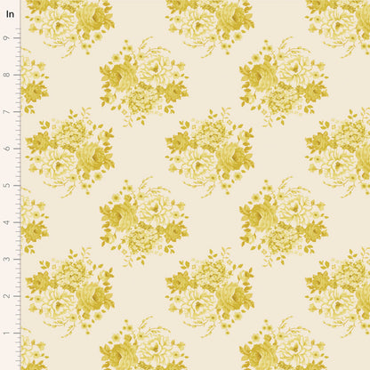 A fabric from the Tilda Sunday Brunch Mia Sour Yellow collection, featuring a floral pattern with yellow flowers on a beige background, measured with a ruler to show scale.
Photo by Tildafabrics.com [image_link]