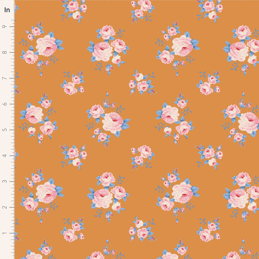 Yardage of Tilda Wallflower Lauren Green fabric featuring a floral pattern with pink and blue flowers on a yellow background with a measuring scale along the edge.
Photo by Tildafabrics.com [image_link]