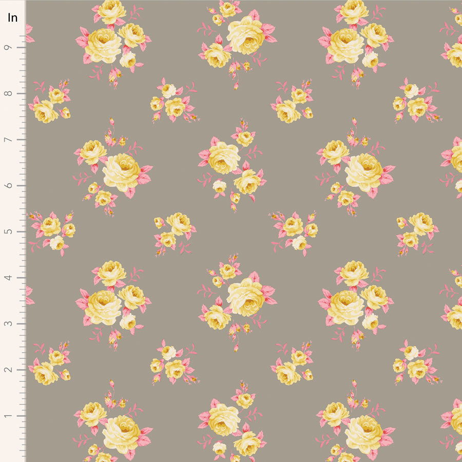 A fabric with a floral pattern featuring roses in shades of pink, yellow, and green, on a grey background, measured with a ruler.
Photo by Tildafabrics.com [image_link]