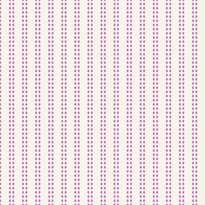 A repeating vertical pattern of small purple dots in pairs on a warm off-white background.
Photo by Tildafabrics.com [additional_image_link]