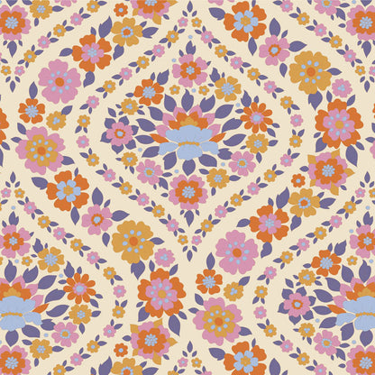 Yardage of floral print fabric featuring a pattern with thistle and other flowers in a multicolor palette on a beige background.
Photo by Tildafabrics.com [additional_image_link]