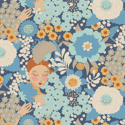 Yardage of Tilda Wallflower Blue fabric featuring a floral pattern with faces and flowers in blue, beige, and green colors on a fabric measuring scale.
Photo by Tildafabrics.com [additional_image_link]
