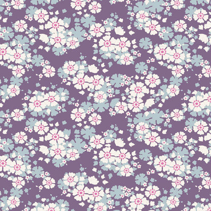 A repeating floral pattern featuring light blue and white blossoms with pink centers on a solid purple background.
Photo by Tildafabrics.com [image_link]