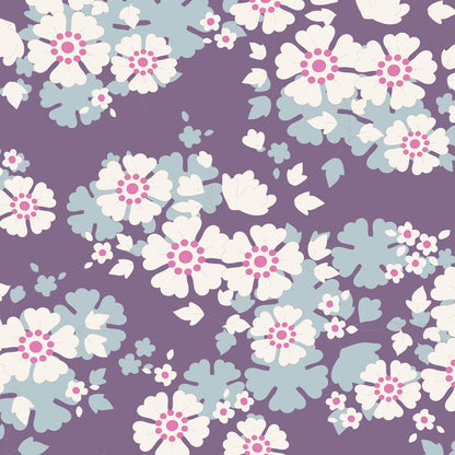A repeating retro floral pattern featuring white flowers with pink centers and light blue-green leaves on a solid purple background.
Photo by Tildafabrics.com [additional_image_link]