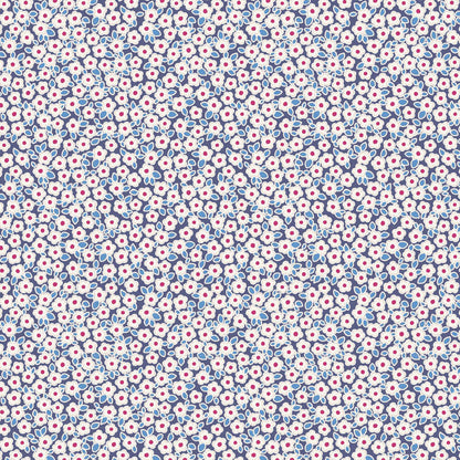 A repeating floral pattern featuring white flowers with pink centers and light blue leaves on a dark navy background.
Photo by Tildafabrics.com [image_link]