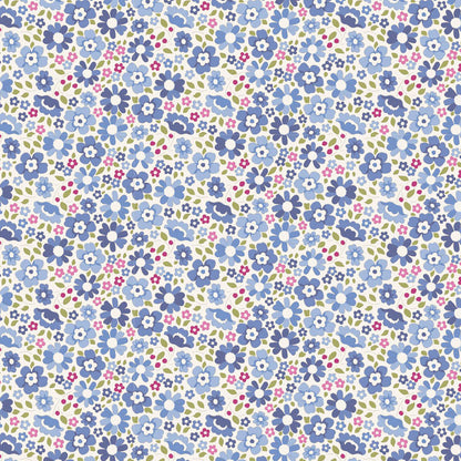 A seamless floral pattern featuring small blue, lavender, pink, and white flowers with green leaves on a white background.
Photo by Tildafabrics.com [image_link]