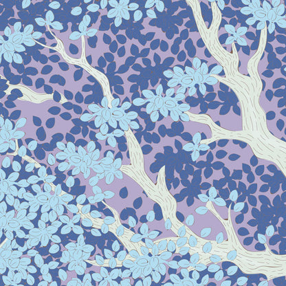 A repeating botanical pattern featuring stylized white tree branches with light blue leaves over a lavender and medium blue dotted background.
Photo by Tildafabrics.com [additional_image_link]