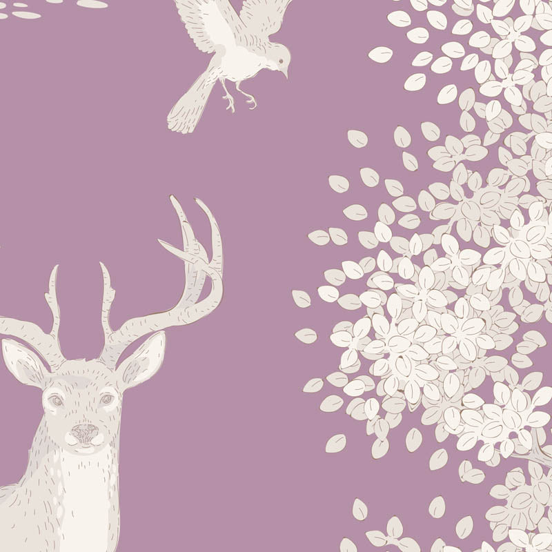 Seamless pattern featuring a cream-colored deer head, a flying bird, and clusters of blossoms on a dusty purple background.
Photo by Tildafabrics.com [additional_image_link]
