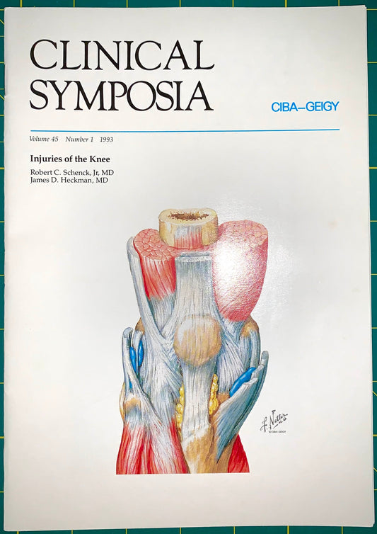 A single copy of the Clinical Symposia journal, Volume 45, Number 3, 1993, featuring an anatomical illustration of knee injuries on the cover. The journal is photographed flat against a green cutting mat background.
[image_link]