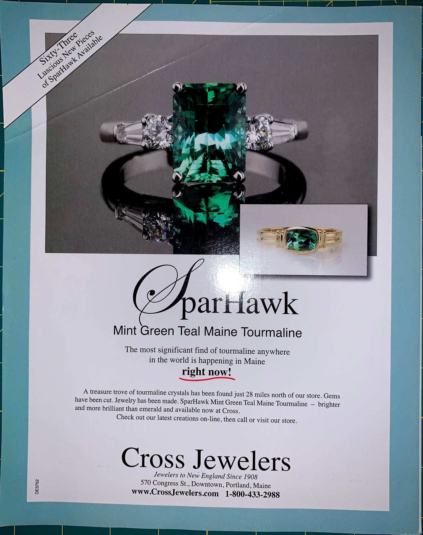 A printed advertisement for Parhawk jewelry featuring a large green tourmaline ring, with smaller inset images and text about mint green teal Maine tourmaline. The ad is photographed on a teal cutting mat.
[additional_image_link]