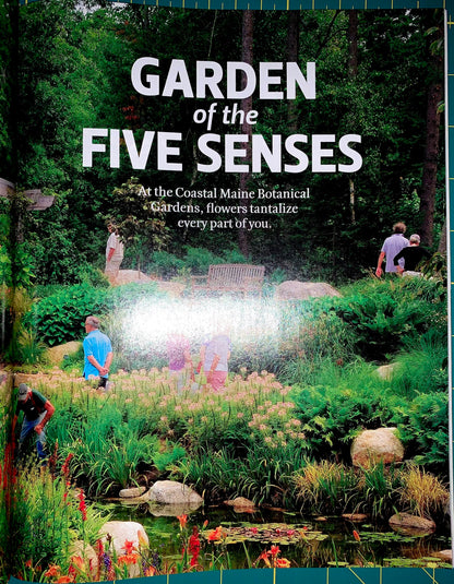 A book cover titled 'GARDEN of the FIVE SENSES' showing a lush garden scene with people exploring the landscape, a pond, rocks, and dense greenery. The subtitle reads, 'At the Coastal Maine Botanical Gardens, flowers, fragrance, and every part of you.
[additional_image_link]