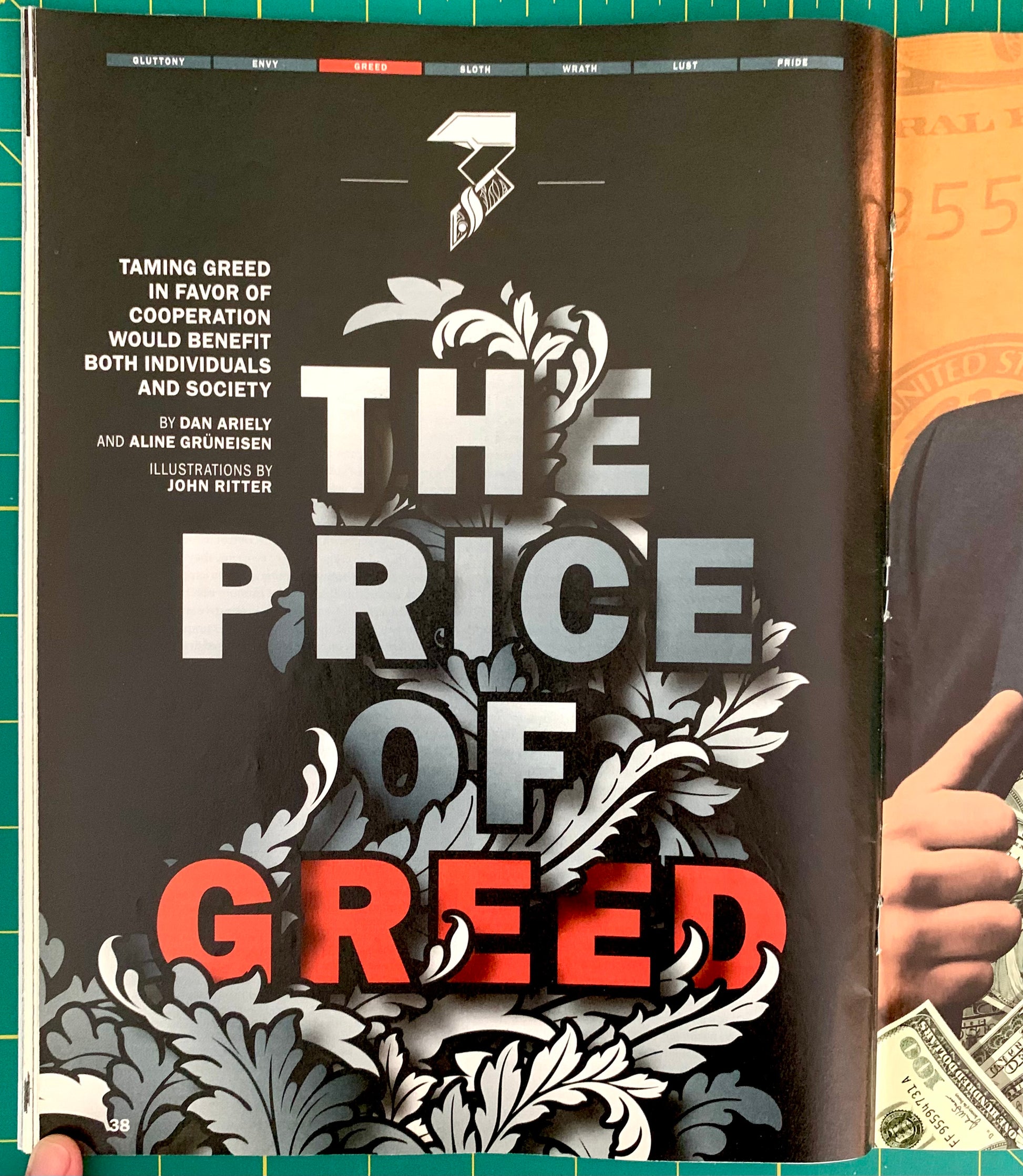 A book cover for 'The Price of Greed' by Dan Ariely and Aline Groenewegen, featuring a black background with ornate white filigree and bold red and gray title text. The book is photographed on a green cutting mat with a hand holding part of another book visible at the right edge.
[additional_image_link]