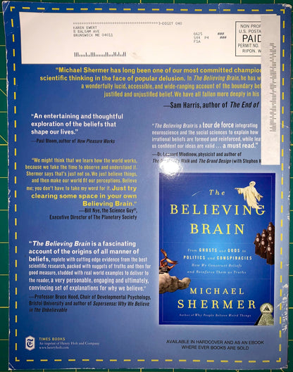 A book cover for 'The Believing Brain' by Michael Shermer, displayed against a blue-green grid background with printed review quotes and publisher text. The cover features a white title area, a blue lower section, and an illustration of a bird flying over a landscape.
[additional_image_link]