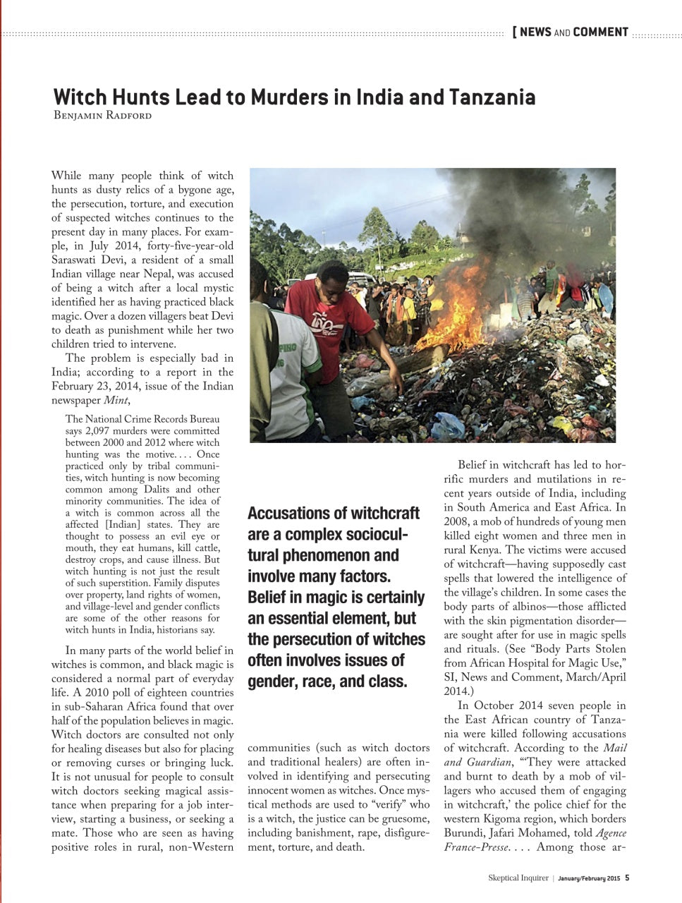 A printed editorial page with the headline 'Witch Huts Lead to Murders in India and Tanzania' and multiple paragraphs of text, plus a small central photograph showing a person holding a camera in a dark setting.
[additional_image_link]