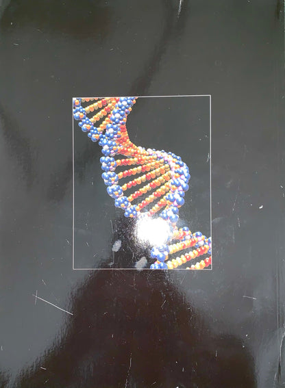 A square printed card or sticker featuring a 3D model of a double helix DNA strand in blue and orange, placed on a dark, reflective surface.
[additional_image_link]