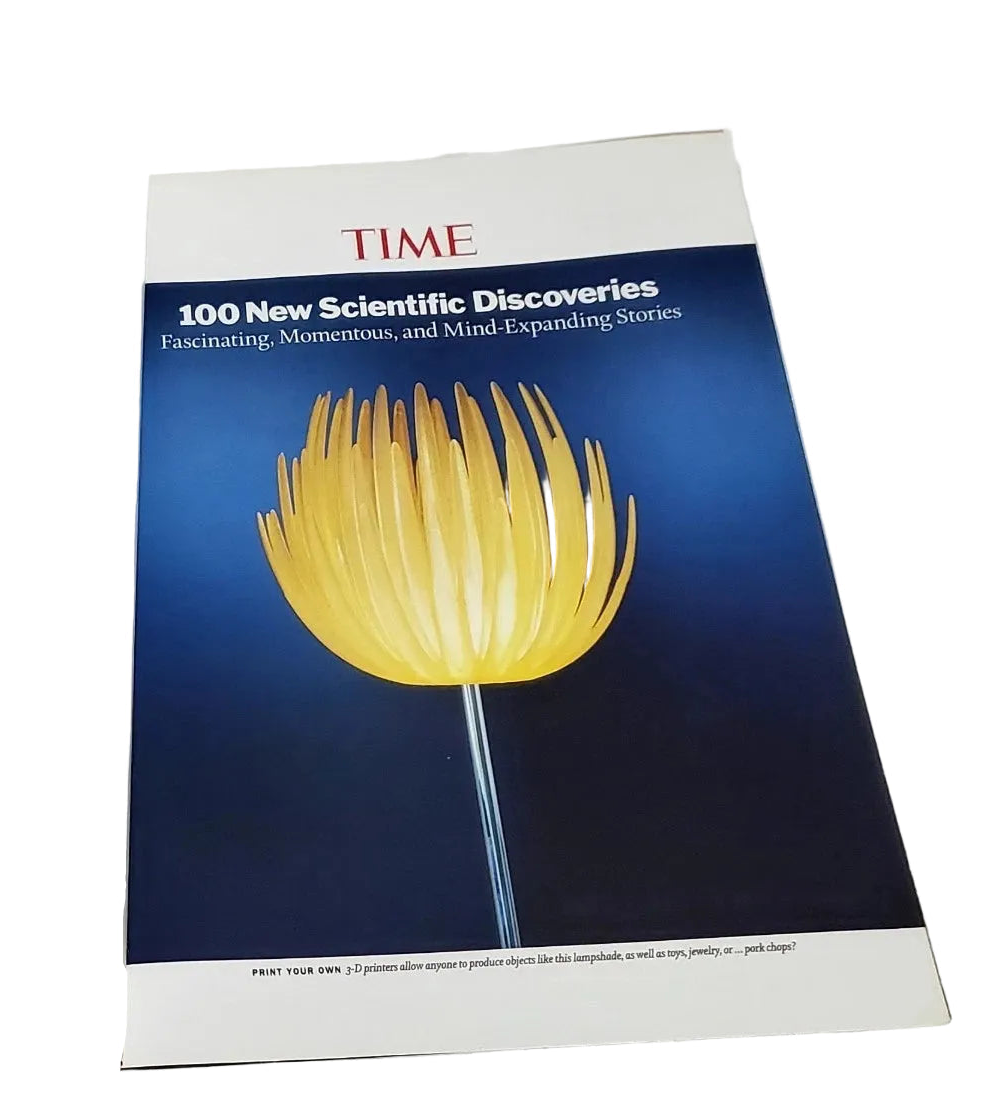 A TIME magazine cover featuring a glowing yellow flower against a dark blue background, photographed on a plain white surface.
[additional_image_link]