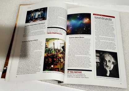 An open magazine or book spread showing multiple printed articles with text, small photos, and one larger space-themed image on the right page, photographed on a light textured surface.
[additional_image_link]