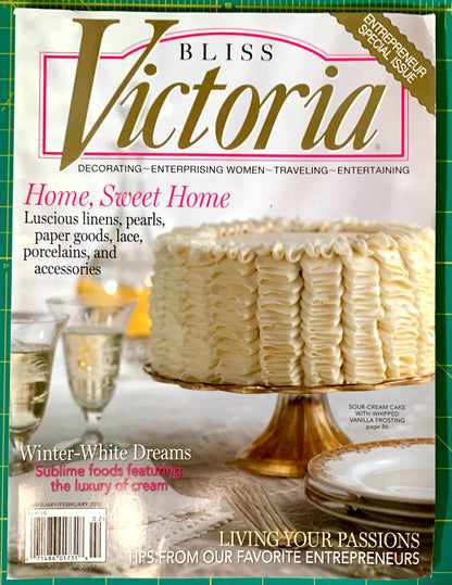 Bliss Victoria magazine cover featuring a large cream-frosted cake on a gold stand, with the title 'Bliss Victoria' at the top and cover lines about home, sweets, and entertaining.
[image_link]