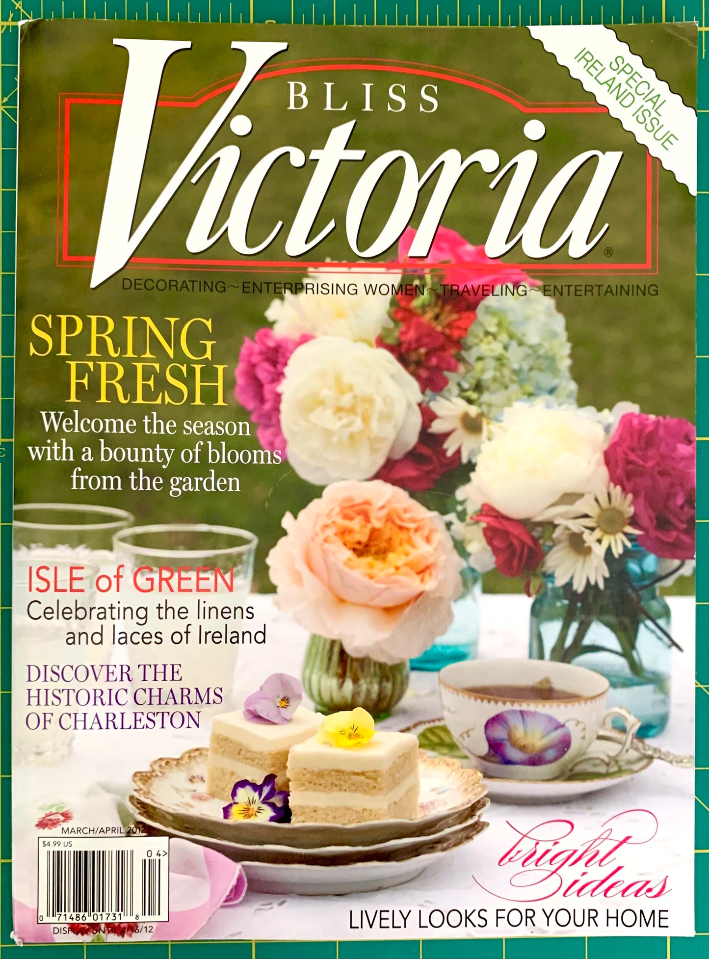 Bliss Victoria magazine cover featuring a spring garden and tea-table scene with flowers, cakes, teacups, and large white 'Victoria' title text over a green background.
[image_link]