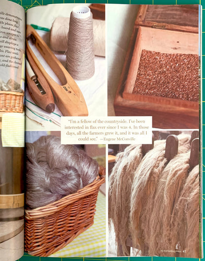 An open book spread featuring a collage of photos related to flax processing: wooden spinning tools, a spool of thread, a close-up of flax seeds in a wooden box, a wicker basket filled with flax, and bundles of processed flax fibers. A quote by Emma McCallion is printed over the center.
[additional_image_link]