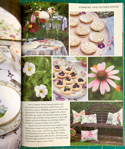 A printed magazine or book spread showing a cooking and entertaining page with photos of decorated cookies, flowers, and a porcelain teapot. The page includes text and multiple inset images arranged in a collage layout.
[additional_image_link]
