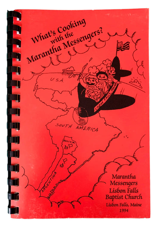 Cover of a vintage cookbook titled 'What's Cooking with the Maranatha Messengers?' featuring a cartoon illustration.
Photo by Karen King [image_link]