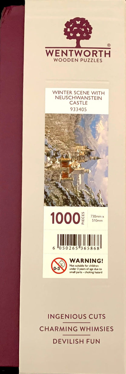 A wooden jigsaw puzzle depicting a winter scene with Neuschwanstein Castle, featuring a mix of shaped and irregular pieces.
Photo by Karen King [additional_image_link]