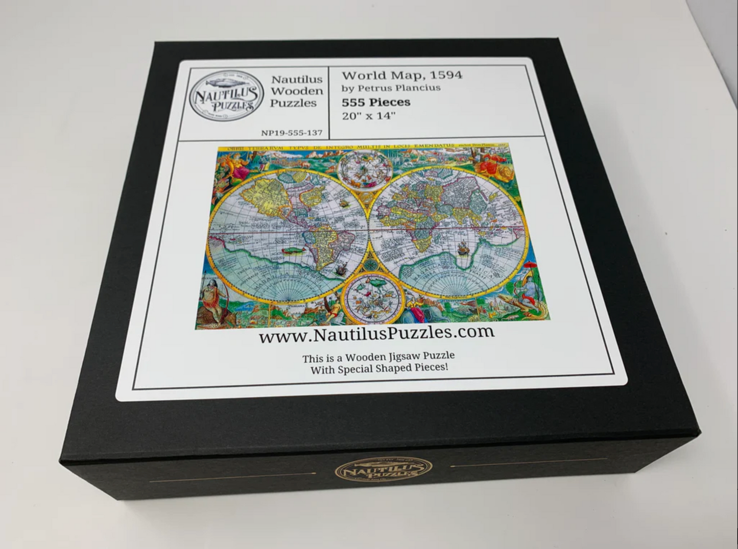 A completed wooden jigsaw puzzle depicting a world map, featuring various stylized countries and a compass in the center.
Photo by Nautilus Puzzles [additional_image_link]
