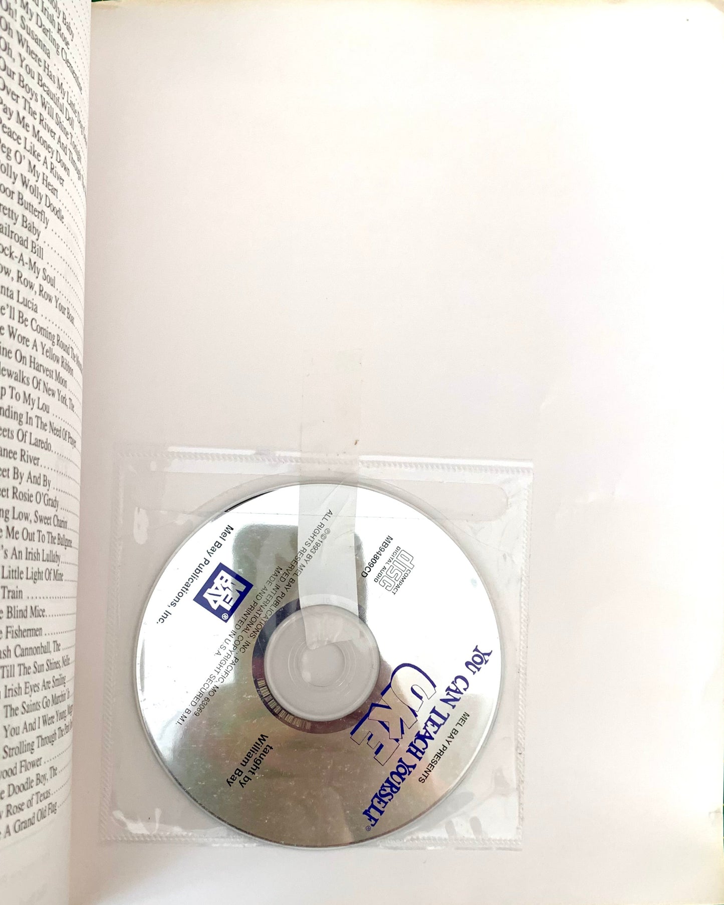 CD disc inside book
Photo by Karen King [additional_image_link]