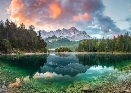 Mountain landscape with a lake and trees under a colorful sky.
Photo by Ravensburger [image_link]