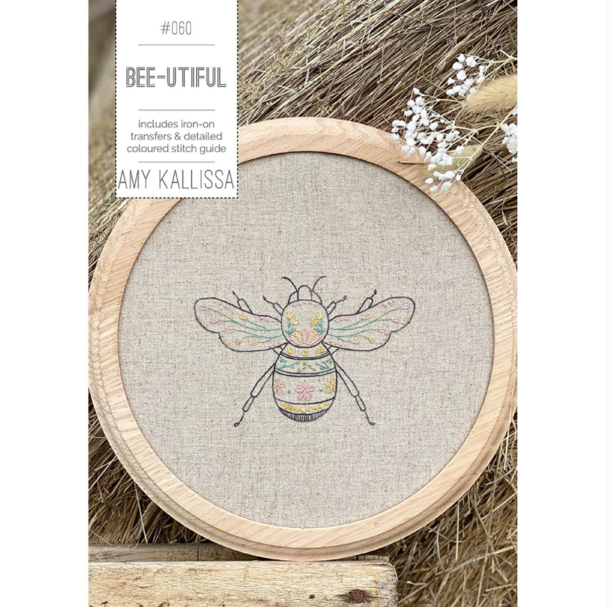 Embroidery kit with bee design in a wooden hoop on a natural background.
Photo by Amy Kallissa [image_link]