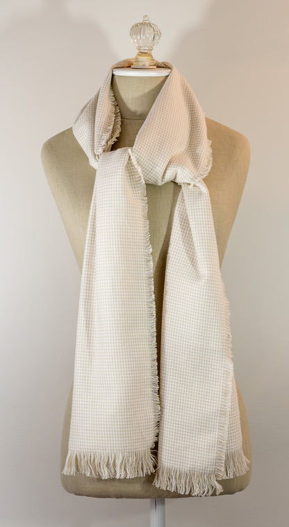 A beige houndstooth flannel scarf displayed on a mannequin, fringed on all sides.
Photo by TheSurgeonsKnots.com [image_link]
