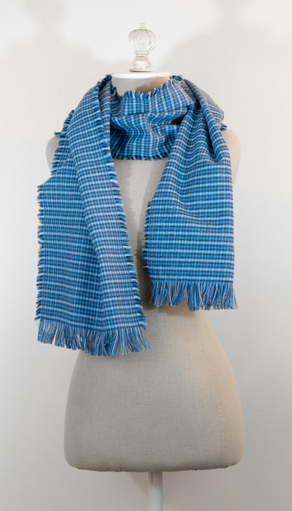 A blue tartan plaid flannel blanket scarf draped over a mannequin bust.
Photo by Karen King  [additional_image_link]