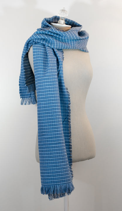 A blue tartan plaid flannel blanket scarf draped over a mannequin bust.
Photo by Karen King  [additional_image_link]