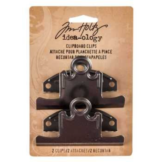 Two black Tim Holtz Ideaology clipboard clips attached to a tan cardboard backing card, photographed against a plain white background.
[additional_image_link]