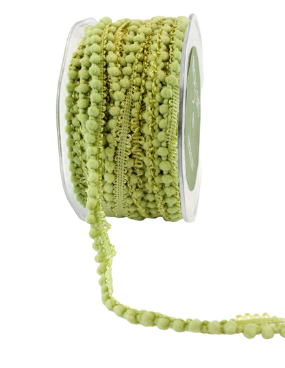 Green mini pom poms.
Photo by May Arts [additional_image_link]