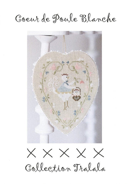 Cross stitch embroidery kit depicting a white hen heart pattern in a heart-shaped linen fabric, with color photos and stitch diagrams.
Photo by Tralala [image_link]