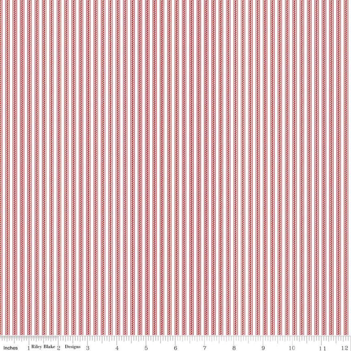 A close-up of a striped fabric pattern with vertical red and white stripes, featuring a measurement ruler along the bottom edge.
Photo by Riley Blake Designs [additional_image_link]