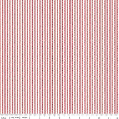 A close-up of a striped fabric pattern with vertical red and white stripes, featuring a measurement ruler along the bottom edge.
Photo by Riley Blake Designs [additional_image_link]
