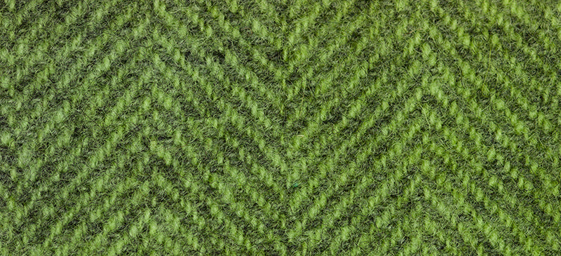 A close-up of a green herringbone woven wool with a soft, fuzzy surface.
Photo by Weeks Dye Works [additional_image_link]