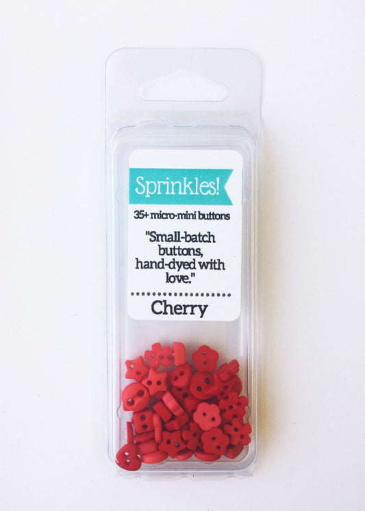 A package of Cherry red sprinkle buttons from Just Another Button Company, containing 35 micro-sized hand-dyed buttons.
Photo by JustAnotherButtonCompany.com [image_link]