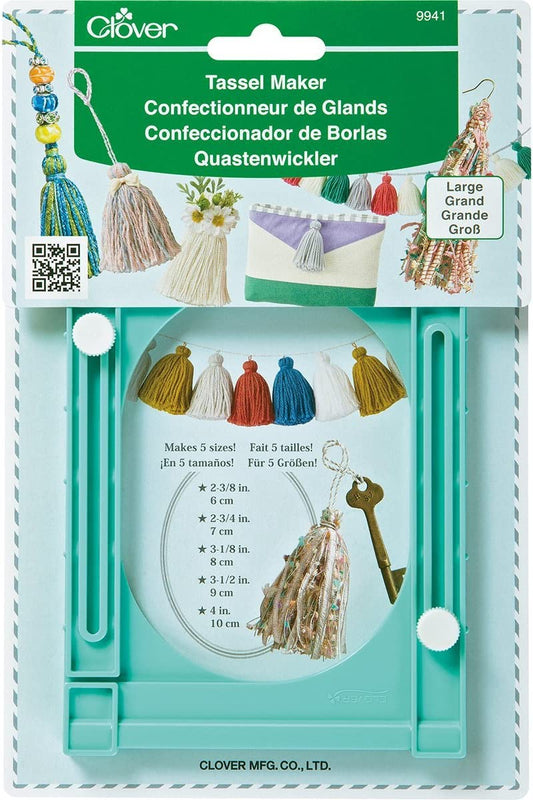 Packaging of Clover Tassel Maker showing the tool and created tassels in various colors, with a green and white theme.
Photo by Clover-USA.com [image_link]