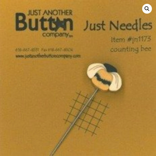 Packaging of a decorative counting pin with a bee design on a tapestry needle, branded by Just Another Button Company.
Photo by JustAnotherButtonCompany.com [image_link]